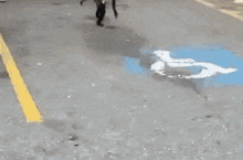a monkey is jumping in the air near a handicapped parking spot