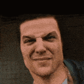 a close up of a man 's face with a funny face