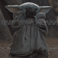 a baby yoda holding a cup with the words baby yoda maaan on it