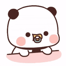 a panda bear is holding a pacifier in its mouth .