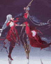 a woman in a red dress stands next to another woman in a black dress