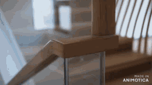 a close up of a wooden railing with the words made in animatica on the bottom