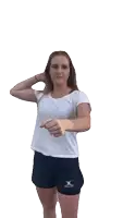 a woman wearing a white shirt and black shorts with gilbert on them