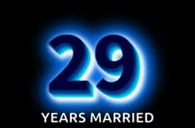 a sign that says 29 years married is lit up in blue