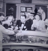 a black and white photo of a group of people
