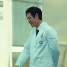a man in a white lab coat has a name tag on his chest that says ' kim '
