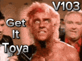 a man talking into a microphone with the words " get it toya " written above him