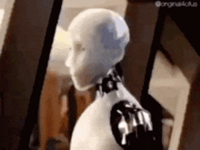 a close up of a robot 's head and arms .