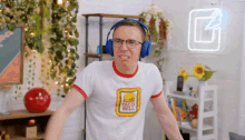 a man wearing headphones and a white taco bell shirt