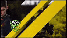a man in a black shirt stands in front of a yellow stripe that says safuu