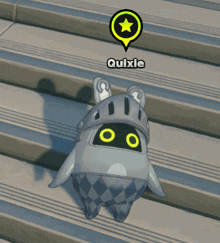 a cartoon character with a helmet and the name quixie above it