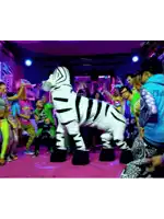 a group of people are dancing in a room with a zebra mascot