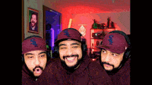 three men wearing hats with the letter s on them are smiling