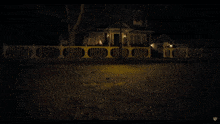 a house with a white fence and a sign that says ' warner ' on it