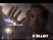 a close up of a man 's hand with the words `` i am inevitable '' written above it .