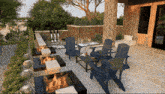 a computer generated image of a patio area with a fire pit and chairs