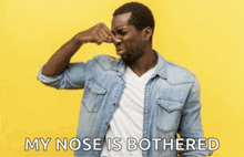 a man covering his nose with his hand with the words " my nose is bothered " above him