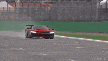 a red sports car is driving on a race track with nm2255 hd written on the bottom of the screen