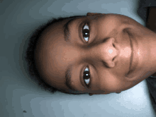 a close up of a person 's face with a smile