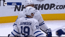 a hockey player with the number 19 on the back