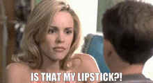 a woman is talking to a man and asking if he has lipstick on .