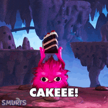a smurf holding a piece of cake with the word cakeee written on it