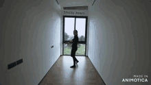 a woman is standing in a hallway with the words study area on the wall