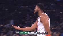a blurred image of a basketball game between bos and east semis
