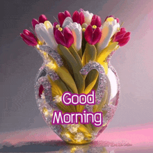 a vase filled with flowers has the words good morning written on it