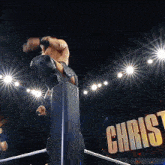 a wrestling ring with the word christ on the wall