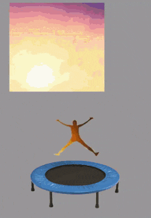 a trampoline with a person doing a handstand in the background