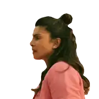 a woman in a pink jacket looks surprised