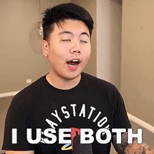 a young man wearing a black shirt that says i use both