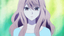 a close up of a girl 's face with purple hair