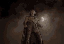 a man in a hooded costume with glowing eyes