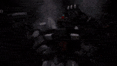 a robot with a purple light coming out of its mouth is fighting another robot .