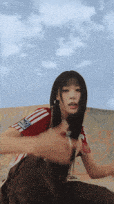 a girl wearing a red and white shirt with the word adidas on the front