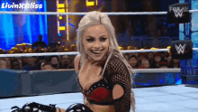a woman in a wrestling ring with the words livin ' bliss on the bottom
