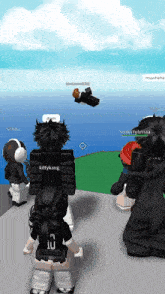 a group of people are playing a video game and one of them has the number 10 on her back