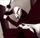 a man wearing a mask is holding a sword