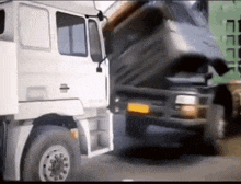 a white truck with the hood up and a yellow license plate that says ' a ' on it