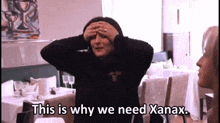 a woman covering her eyes with her hands and the words this is why we need xanax