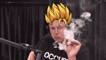 a man wearing a black shirt with the word occupy on it smoking a cigarette