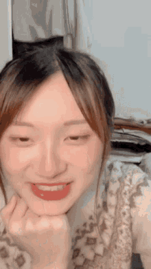 a close up of a woman 's face with her eyes closed