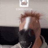 a man wearing a horse mask with starriver 04 written on it