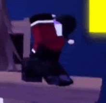 a person wearing a santa hat and a red jacket is standing in front of a yellow light .