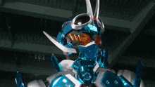 a close up of a robot 's head with a blue and white helmet