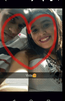 a picture of a man and a woman with a red heart around their faces with the word vida below them