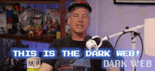 a man is sitting in front of a microphone with the words this is the dark web