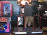 a man is dancing in front of a machine that says deal medical